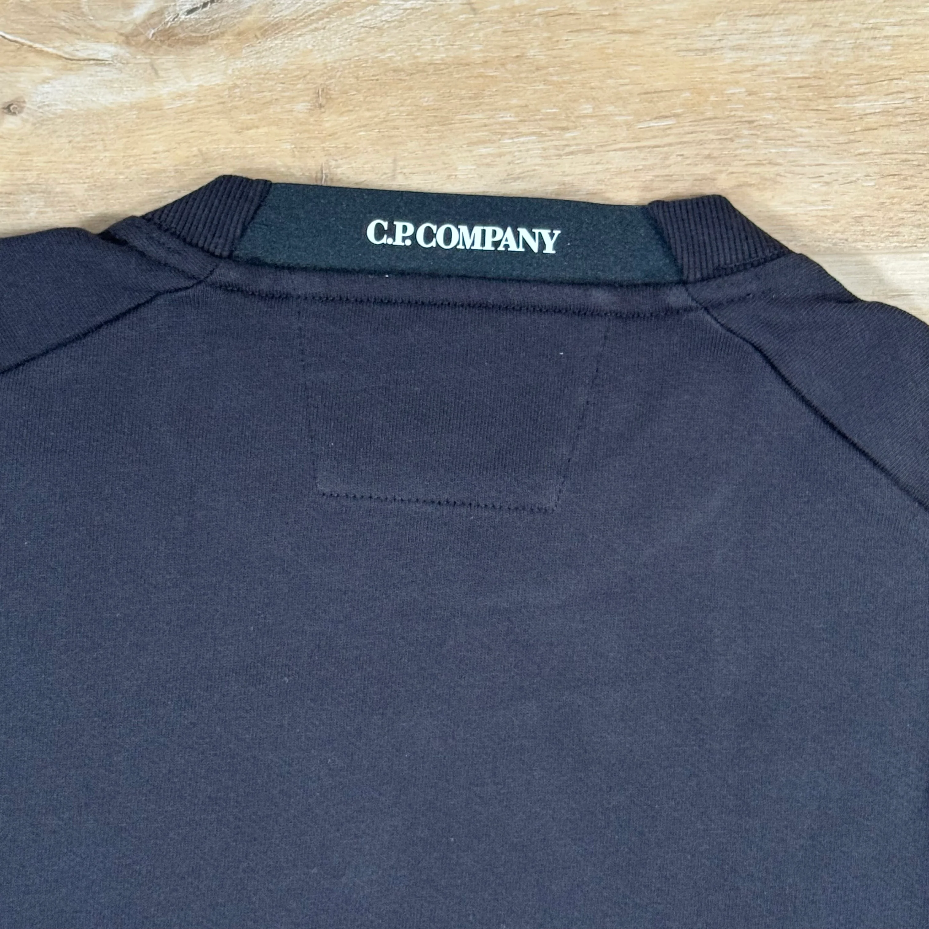 C.P. Company Diagonal Raised Fleece Crewneck Lens Sweatshirt in Black - Image 4