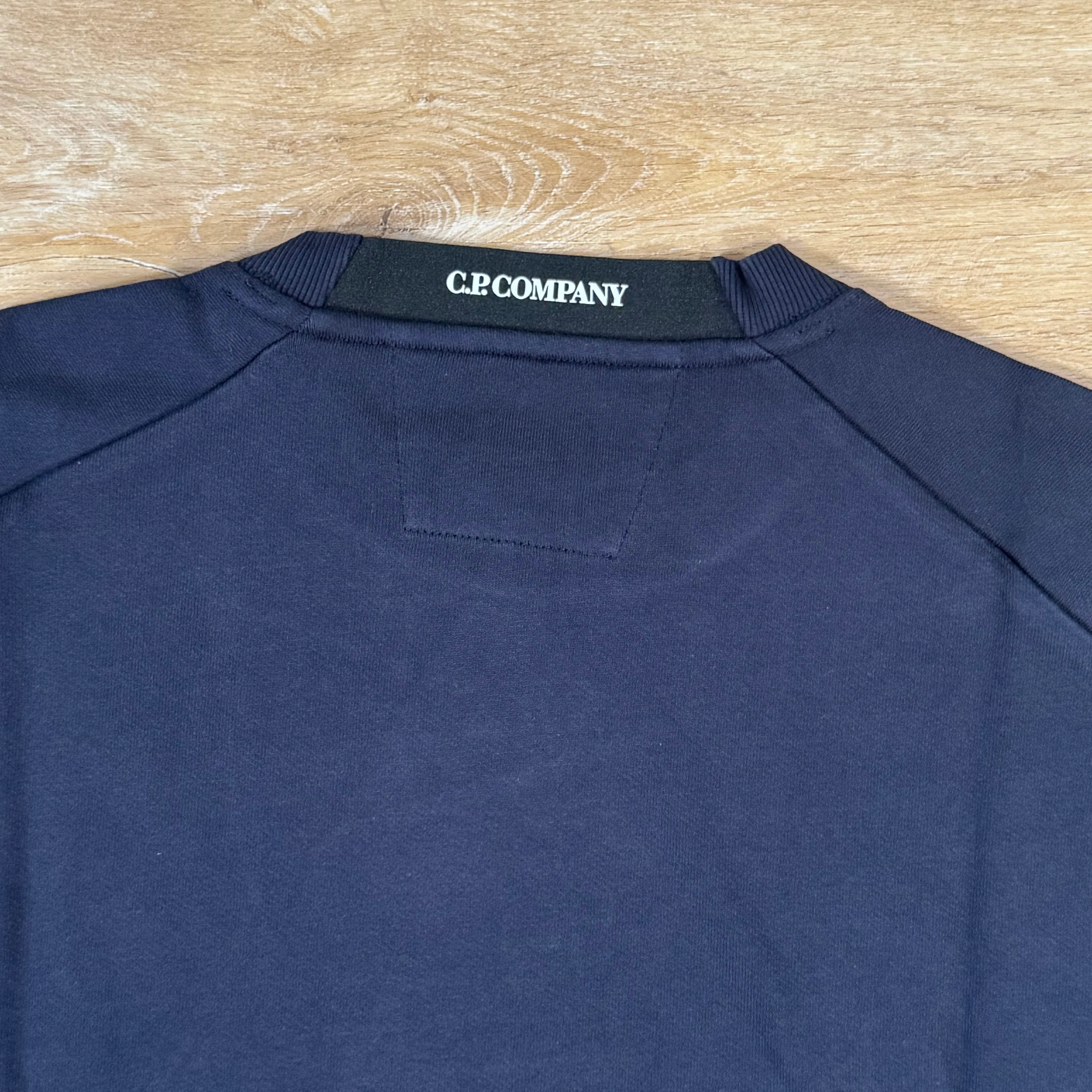 C.P. Company Diagonal Raised Fleece Crewneck Lens Sweatshirt in Navy - Image 4